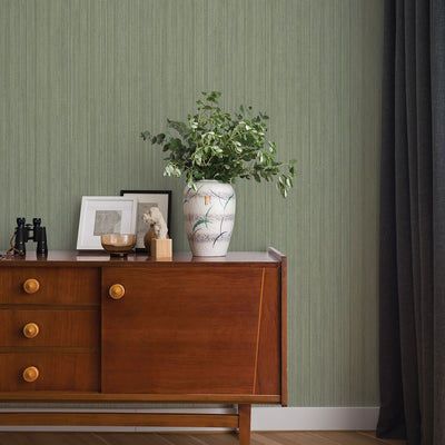 Faux Grasscloth Removable Wallpaper - A wood sideboard with a vase and plant in a room featuring Faux Grasscloth Peel And Stick Wallpaper in textured sage | Tempaper#color_textured-sage