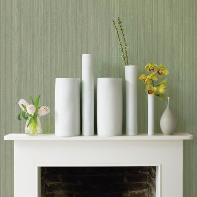Faux Grasscloth Removable Wallpaper - A white fireplace with plants and white vases in a room featuring Faux Grasscloth Peel And Stick Wallpaper in textured sage | Tempaper#color_textured-sage