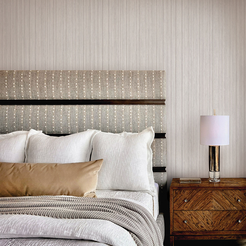 Faux Grasscloth Removable Wallpaper - A bedroom with a bed and wood nightstand featuring Faux Grasscloth Peel And Stick Wallpaper in textured sterling silver | Tempaper#color_textured-sterling-silver