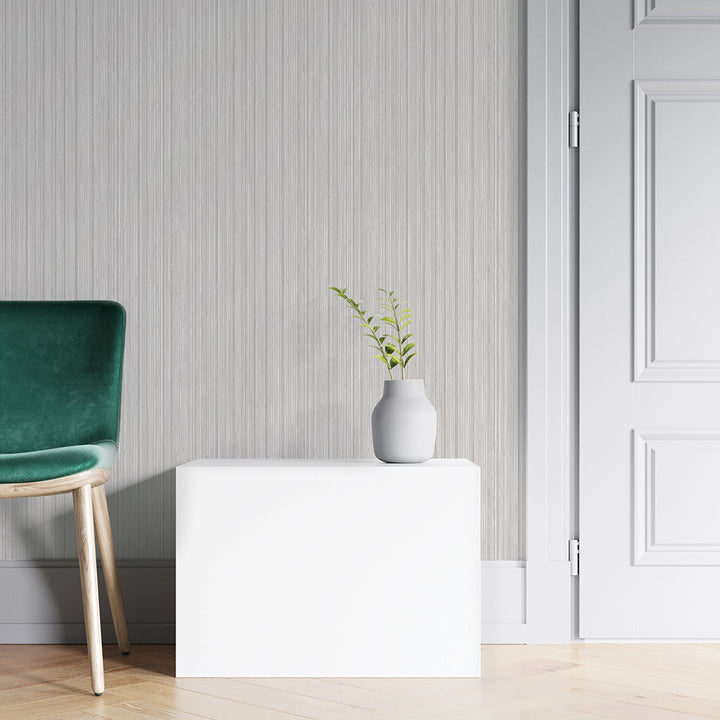 Faux Grasscloth Removable Wallpaper - A green chair and white table in a room featuring Faux Grasscloth Peel And Stick Wallpaper in textured sterling silver | Tempaper#color_textured-sterling-silver