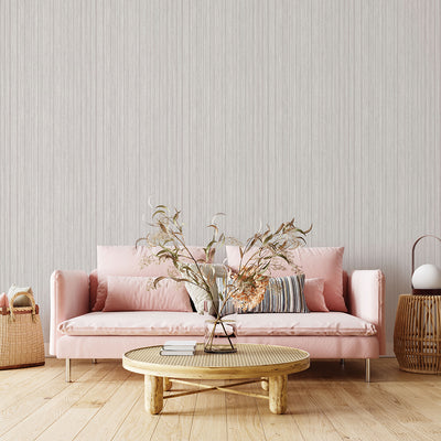 Faux Grasscloth Removable Wallpaper - A pink couch and wood coffee table in a room featuring Faux Grasscloth Peel And Stick Wallpaper in textured sterling silver | Tempaper#color_textured-sterling-silver