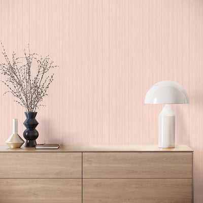 Faux Grasscloth Removable Wallpaper - A wood sideboard with a white lamp in a room featuring Faux Grasscloth Peel And Stick Wallpaper in textured blush | Tempaper#color_textured-blush