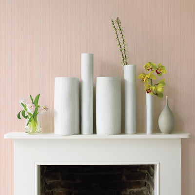Faux Grasscloth Removable Wallpaper - A white fireplace with plants and white vases in a room featuring Faux Grasscloth Peel And Stick Wallpaper in textured blush | Tempaper#color_textured-blush