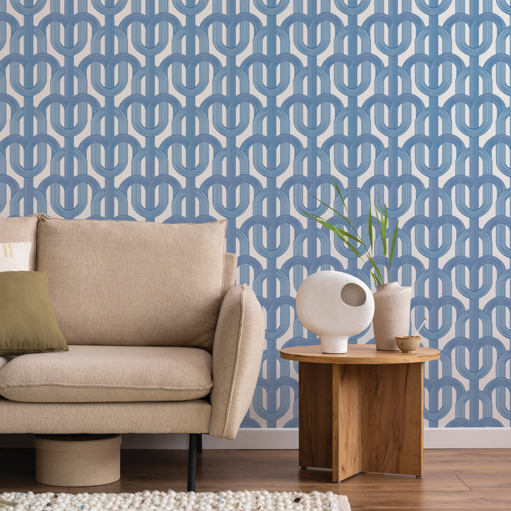 Blue lattice wallpaper paired with a neutral color couch and wooden side table #color_ice-blue