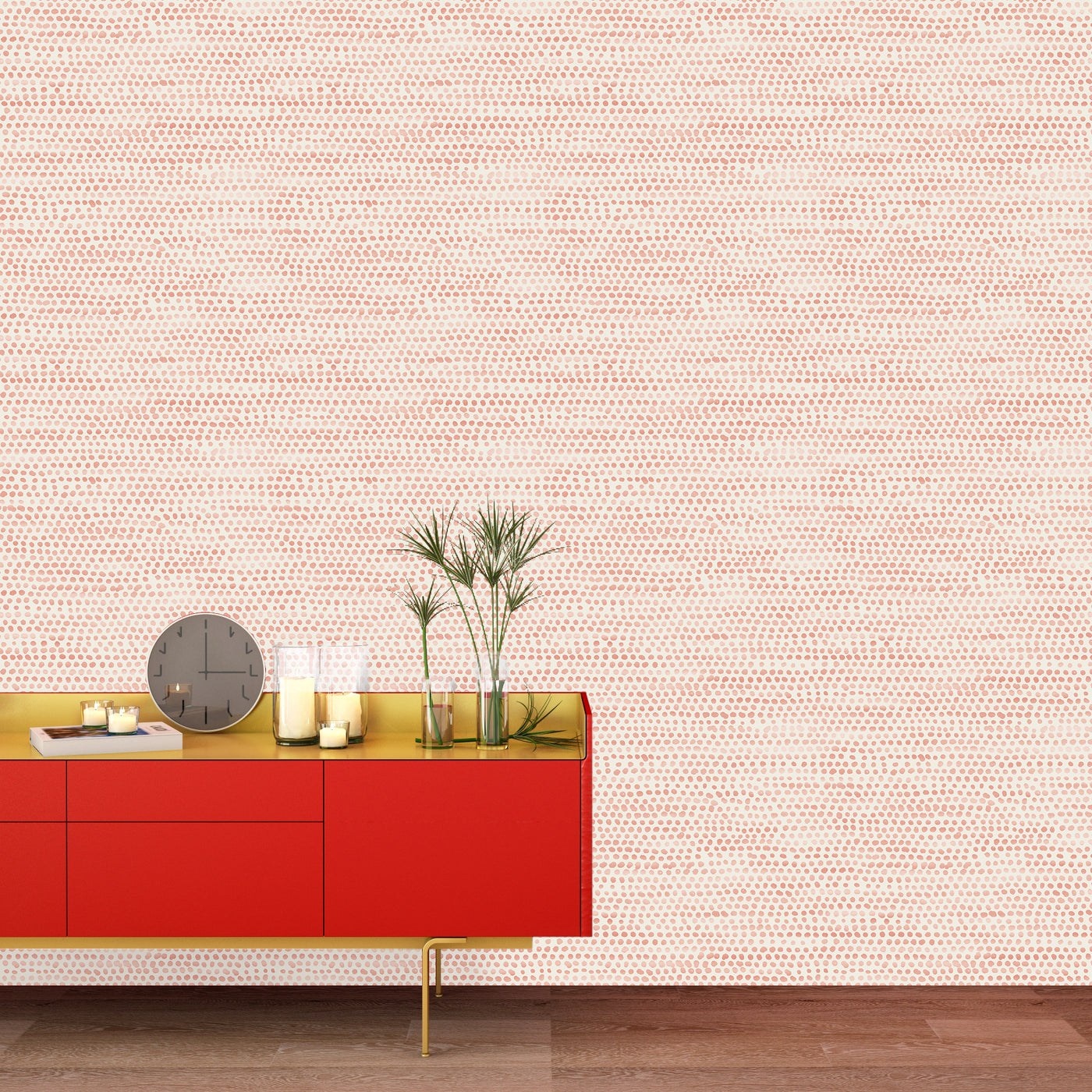 Moire Dots Removable Wallpaper - A red sideboard with plants, a clock, and candles in a room featuring Tempaper's Moire Dots Peel And Stick Wallpaper in coral dots | Tempaper#color_coral-dots