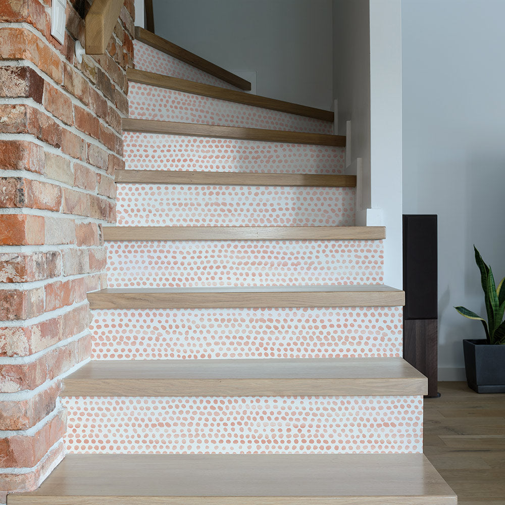 Moire Dots Removable Wallpaper - A brick wall with stairs featuring Tempaper's Moire Dots Peel And Stick Wallpaper in coral dots | Tempaper#color_coral-dots