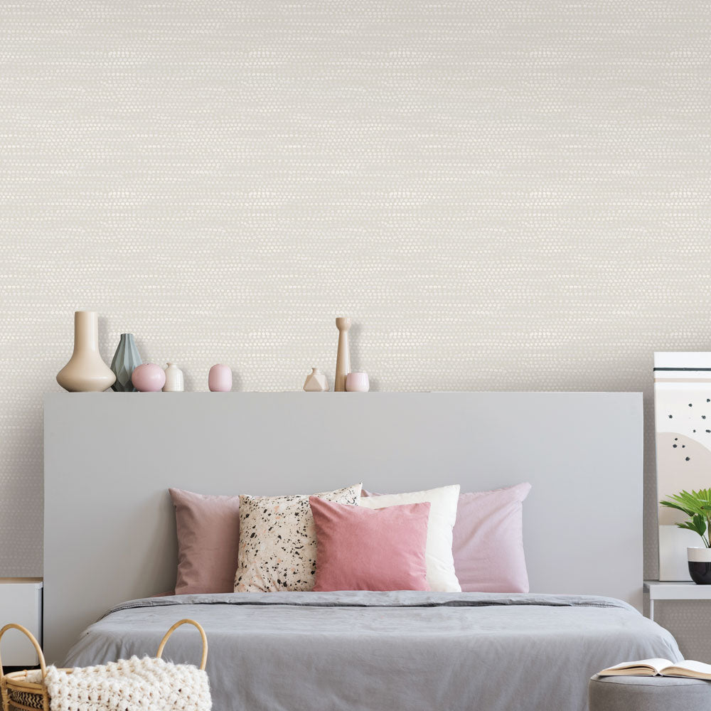 Moire Dots Removable Wallpaper - A bedroom with a grey bed in front of a wall featuring Tempaper's Moire Dots Peel And Stick Wallpaper in pearl grey dots | Tempaper#color_pearl-grey-dots