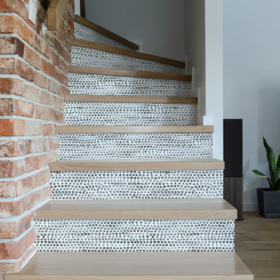 Moire Dots Removable Wallpaper - A brick wall with stairs featuring Tempaper's Moire Dots Peel And Stick Wallpaper in black and white dots | Tempaper#color_black-and-white-dots