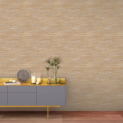 Moire Dots Removable Wallpaper - A grey sideboard with plants, a clock, and candles in a room featuring Tempaper's Moire Dots Peel And Stick Wallpaper in toasted turmeric dots | Tempaper#color_toasted-turmeric-dots