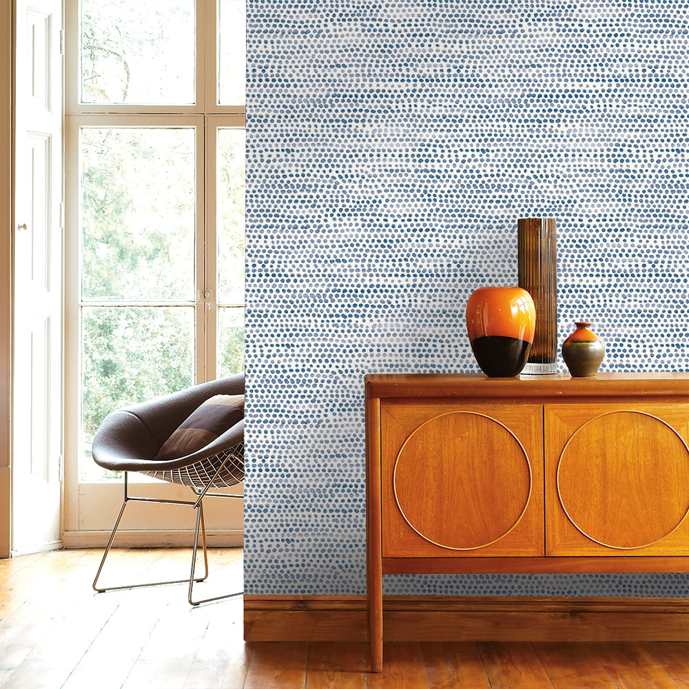 Moire Dots Removable Wallpaper - A wood dresser with three vases on top in front of a wall featuring Tempaper's Moire Dots Peel And Stick Wallpaper in blue moon dots | Tempaper#color_blue-moon-dots