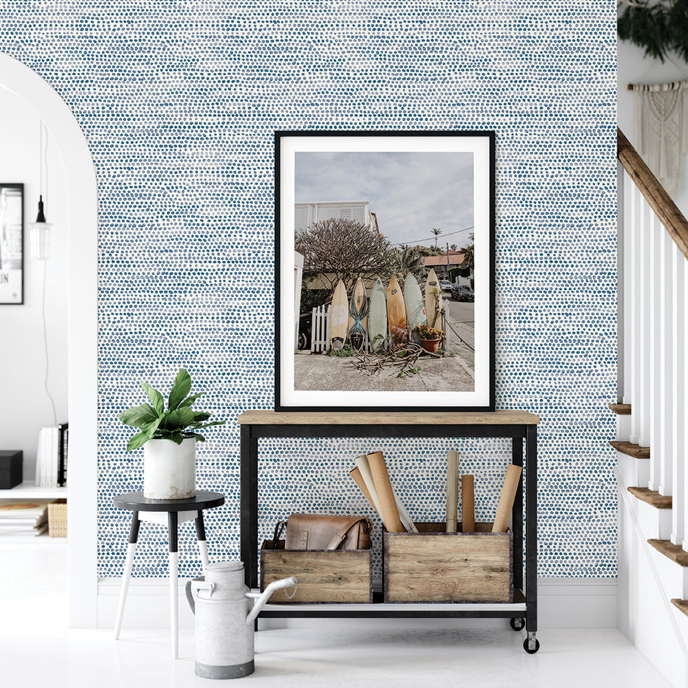 Moire Dots Removable Wallpaper - A black cart, white and black small table, and a picture in front of a wall featuring Tempaper's Moire Dots Peel And Stick Wallpaper in blue moon dots | Tempaper#color_blue-moon-dots