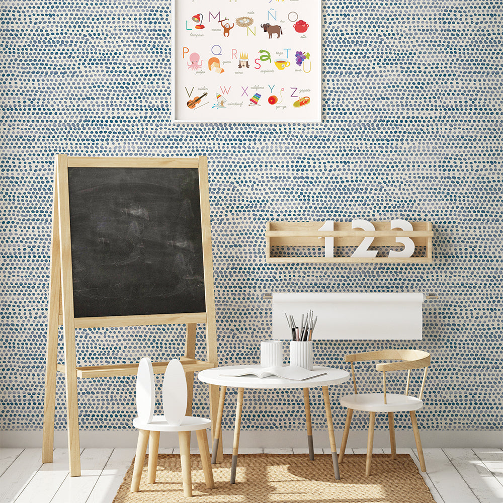 Moire Dots Removable Wallpaper - A kids bedroom with a white table and chairs in front of a wall featuring Tempaper's Moire Dots Peel And Stick Wallpaper in blue moon dots | Tempaper#color_blue-moon-dots