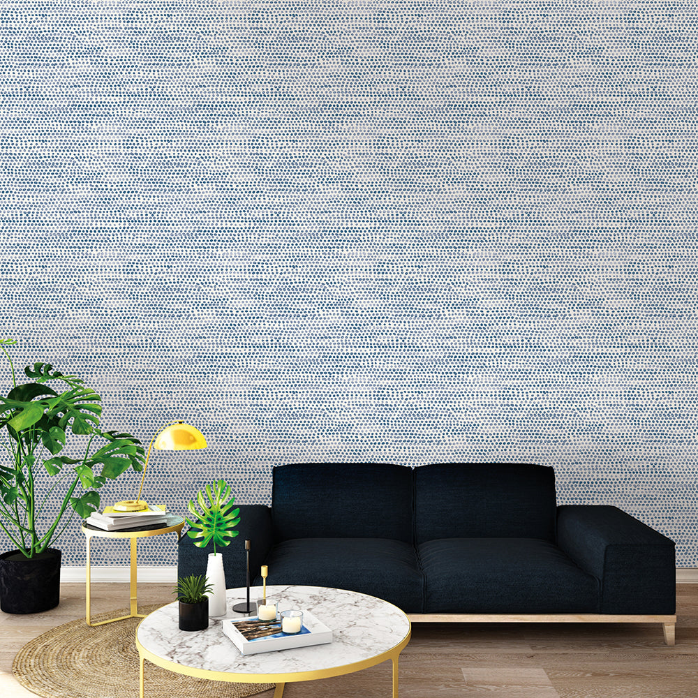 Moire Dots Removable Wallpaper - A black couch, coffee table, and plants in front of a wall featuring Tempaper's Moire Dots Peel And Stick Wallpaper in blue moon dots | Tempaper#color_blue-moon-dots