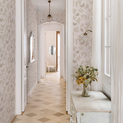 Monarch Non-Pasted Wallpaper - A hallway with a white dresser and plant featuring Monarch Unpasted Wallpaper in fawn | Tempaper#color_fawn