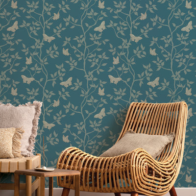 Monarch Non-Pasted Wallpaper - A tan chair in front of Monarch Unpasted Wallpaper in spruce | Tempaper#color_spruce