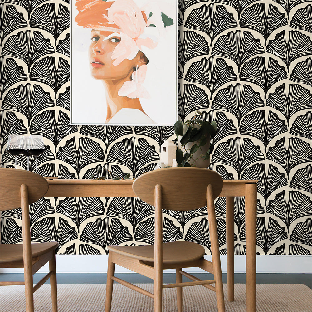 Feather Palm Removable Wallpaper by Novogratz - Two wood chairs and a wood table with wine glasses on top in a room featuring Tempaper's Feather Palm Peel And Stick Wallpaper by Novogratz in zebra black palm | Tempaper#color_zebra-black-palm