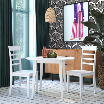 Feather Palm Removable Wallpaper by Novogratz - A white table, white chairs, and a wood dresser in a room featuring Tempaper's Feather Palm Peel And Stick Wallpaper by Novogratz in zebra black palm | Tempaper#color_zebra-black-palm