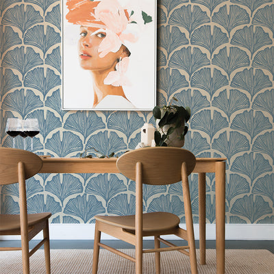 Feather Palm Removable Wallpaper by Novogratz - Two wood chairs and a wood table with wine glasses on top in a room featuring Tempaper's Feather Palm Peel And Stick Wallpaper by Novogratz in waverly blue palm | Tempaper#color_waverly-blue-palm
