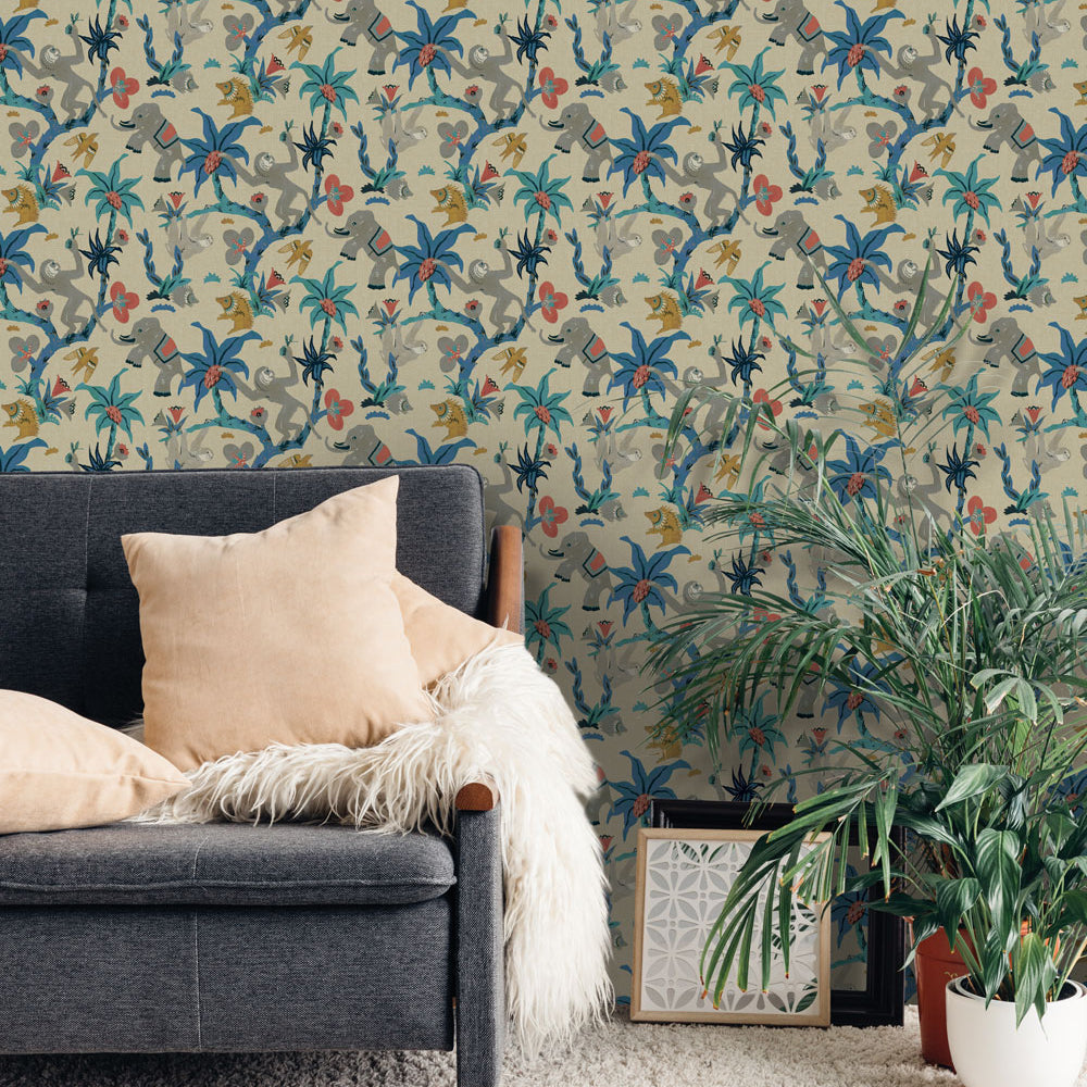 Monkey Business Removable Wallpaper By Novogratz - A grey couch with beige throw pillows and a couple of plants in a room featuring Monkey Business Peel And Stick Wallpaper By Novogratz in banana blossom | Tempaper#color_banana-blossom
