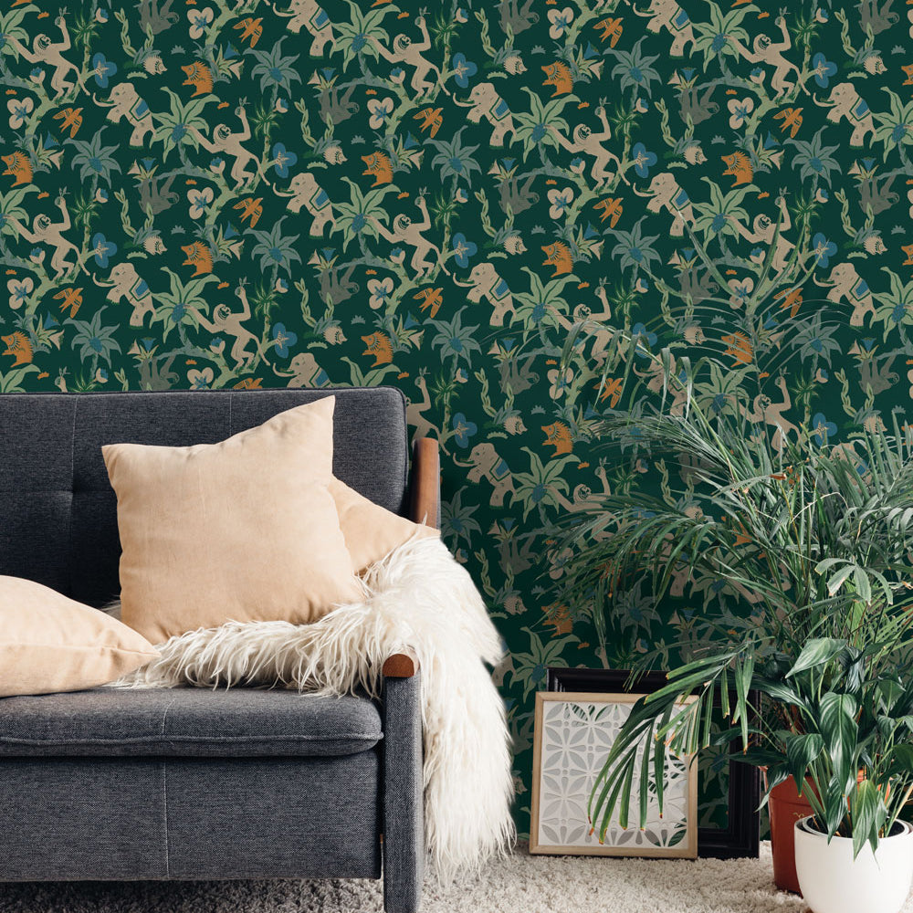 Monkey Business Removable Wallpaper By Novogratz - A grey couch with beige throw pillows and a couple of plants in a room featuring Monkey Business Peel And Stick Wallpaper By Novogratz in jade parade | Tempaper#color_jade-parade
