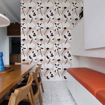 Painted Palm Removable Wallpaper - A wood table with four chairs and a white bench in front of a wall featuring Painted Palm Peel And Stick Wallpaper in cocoa chic | Tempaper#color_cocoa-chic