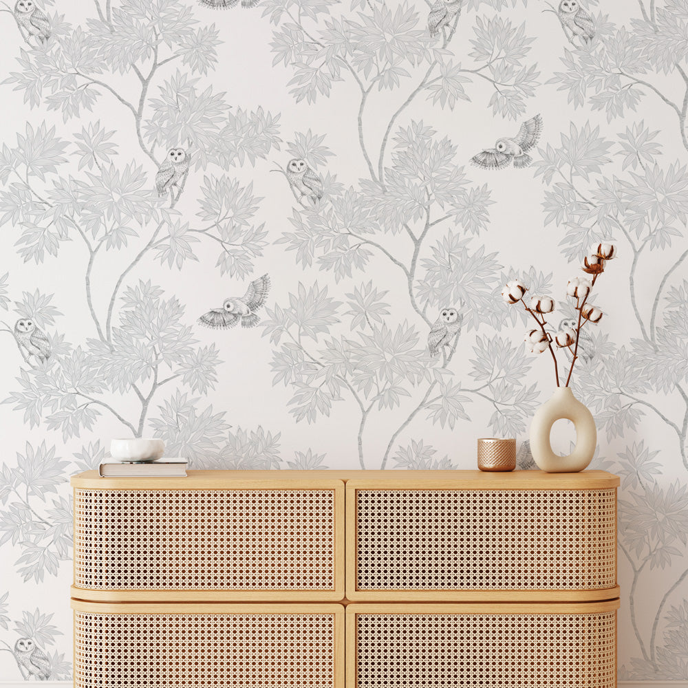 Parliament Non-Pasted Wallpaper - A tan dresser and a plant with Parliament Unpasted Wallpaper in snow white | Tempaper#color_snow-white