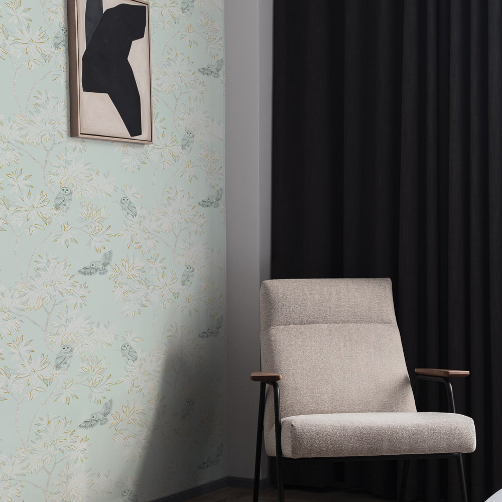 Parliament Non-Pasted Wallpaper - A grey chair and black curtain with Parliament Unpasted Wallpaper in celeste | Tempaper#color_celeste