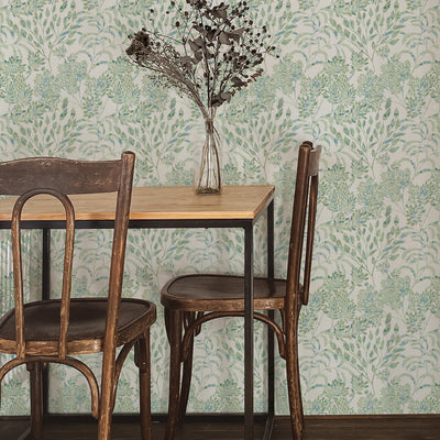 Stencil Foliage Non-Pasted Wallpaper - A wood table and chairs with Stencil Foliage Unpasted Wallpaper in eucalyptus | Tempaper#color_eucalyptus