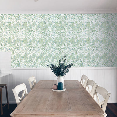 Stencil Foliage Non-Pasted Wallpaper - A wood table and chairs with Stencil Foliage Unpasted Wallpaper in eucalyptus | Tempaper#color_eucalyptus
