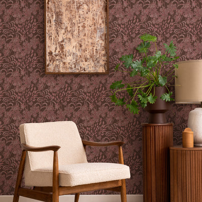 Stencil Foliage Non-Pasted Wallpaper - A chair and plant in front of Stencil Foliage Unpasted Wallpaper in mulberry | Tempaper#color_mulberry