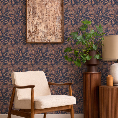 Stencil Foliage Non-Pasted Wallpaper - A chair and plant in front of Stencil Foliage Unpasted Wallpaper in navy and mauve | Tempaper#color_navy-and-mauve