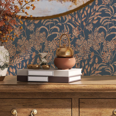 Stencil Foliage Non-Pasted Wallpaper - A wood dresser with books featuring Stencil Foliage Unpasted Wallpaper in navy and mauve | Tempaper#color_navy-and-mauve