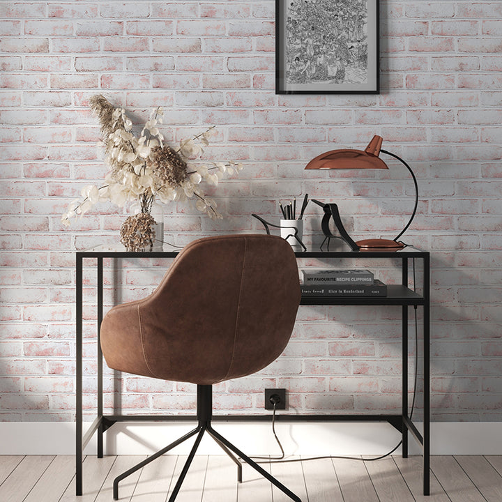 Tempaper's Whitewashed Brick Peel And Stick Wallpaper behind a black desk and brown chair.