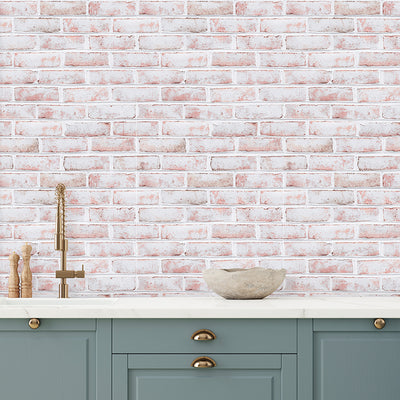 Tempaper's Whitewashed Brick Peel And Stick Wallpaper shown in a kitchen behind a sink.