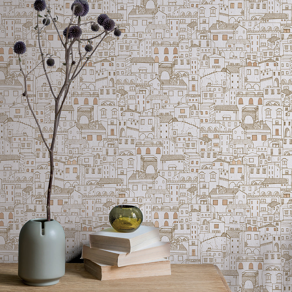 Amalfi WALLPAPER behind a table and vase with long-stemmed flowers.