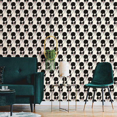 Tempaper's XOXO Stace Temporary Wallpaper By Alice + Olivia behind a green couch and green chair.