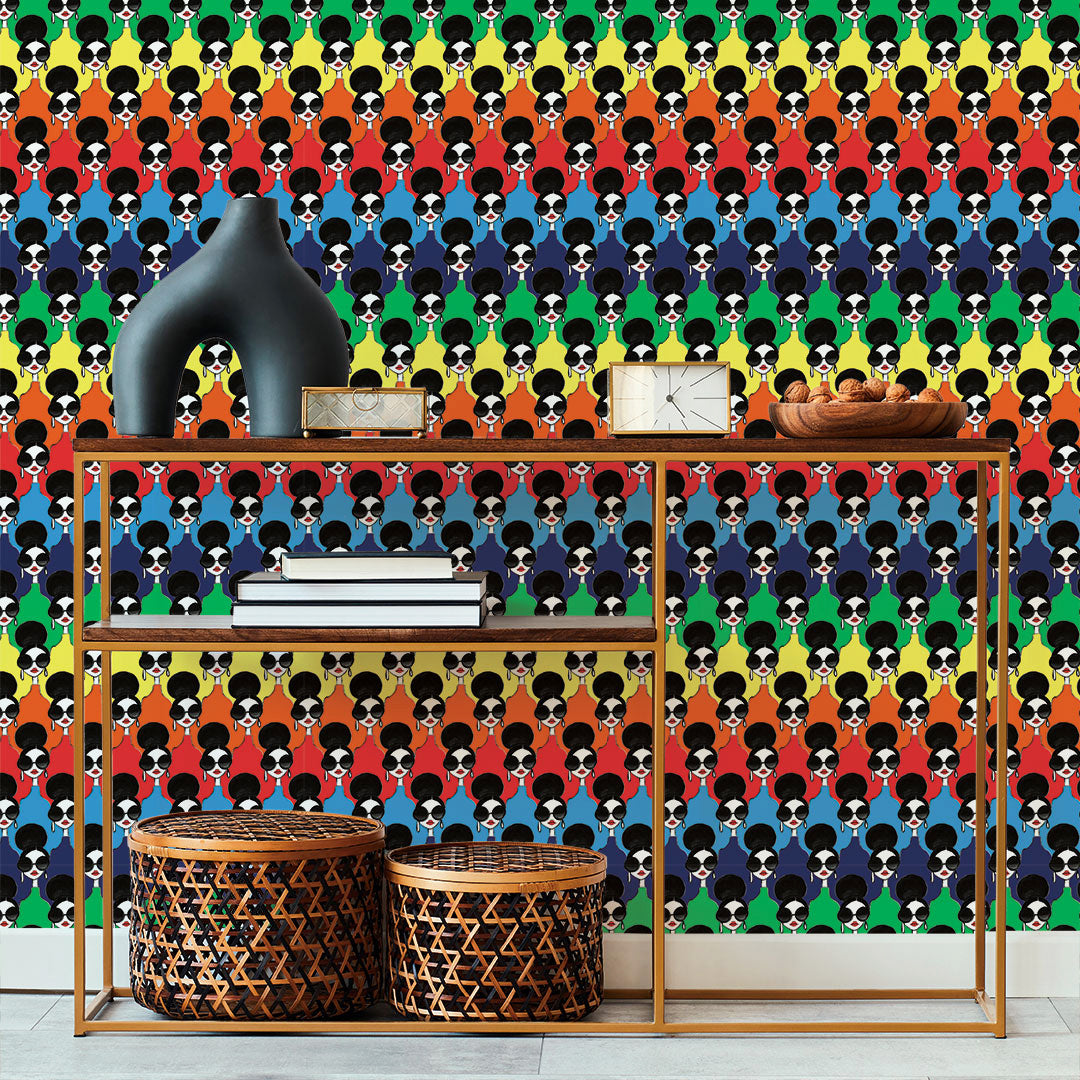 Tempaper's Rainbow Stace Peel And Stick Wallpaper By Alice + Olivia behind a gold desk.