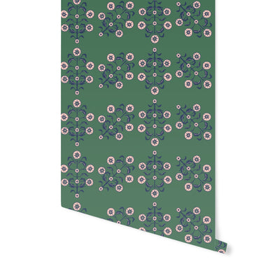 One slightly unraveled roll of Block Print Floral WALLPAPER in green.