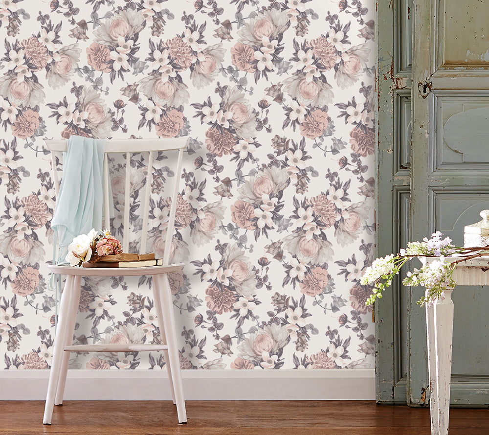 Botanical WALLPAPER displayed behind a white wooden chair.
