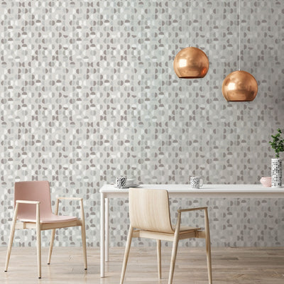 Tempaper's Coffee Beans Peel And Stick Wallpaper in grey shown behind a table and chairs.