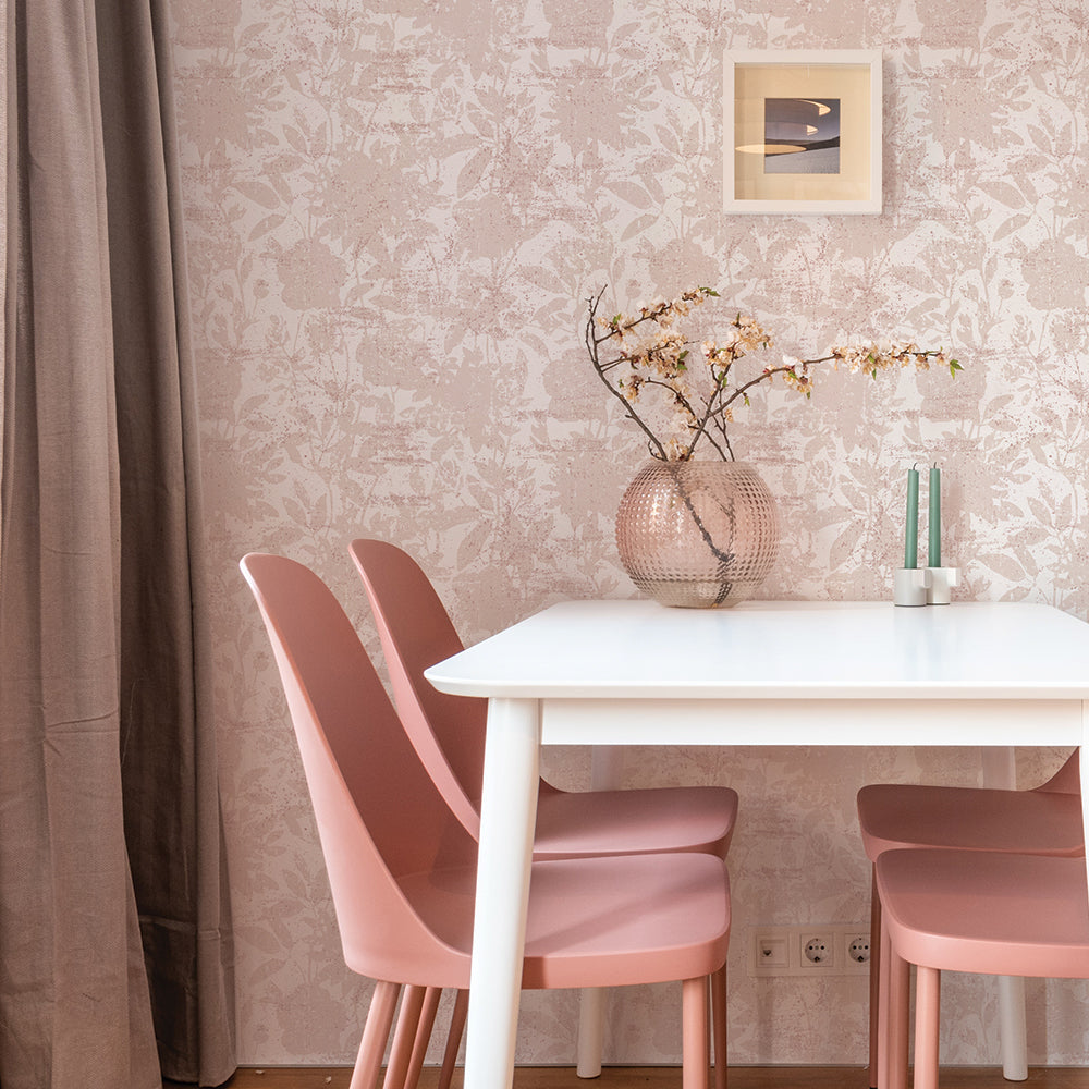 Tempaper's Garden Floral Peel And Stick Wallpaper shown behind a table and chairs.
