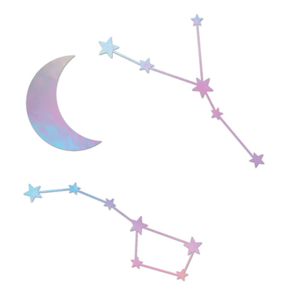 A sample of Tempaper wall decals with a holographic moon and two types of constellations.