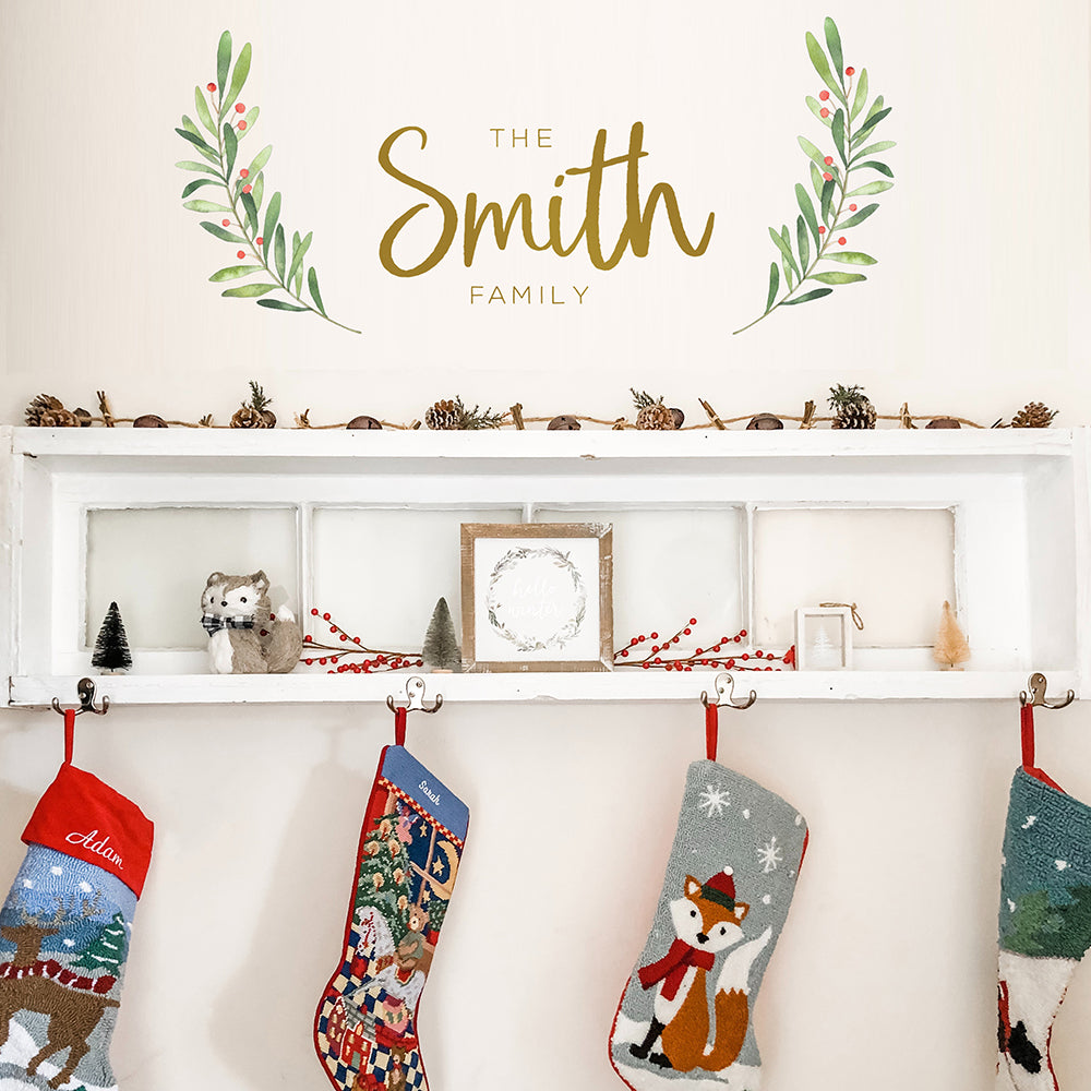 An up close view of Tempaper's Custom Family Name Wall Decal with "The Smith Family" as an example shown above a shelf.