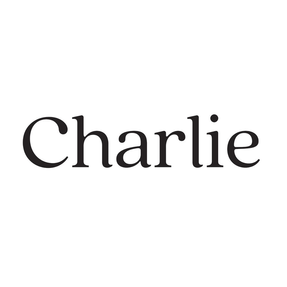 A close up view of Tempaper's Charlie custom name wall decal in black.#color_black