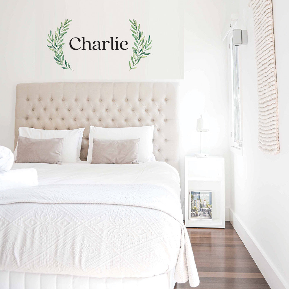 Tempaper's Charlie custom name wall decal in black and green shown in a bedroom.#color_black
