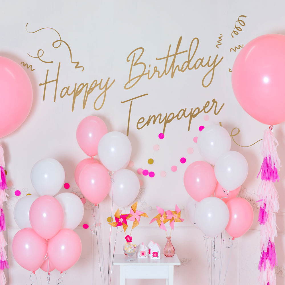 Tempaper's Custom Happy Birthday Wall Decal with "Happy Birthday Tempaper" as an example shown surrounded by balloons.