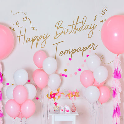Tempaper's Custom Happy Birthday Wall Decal with "Happy Birthday Tempaper" as an example shown surrounded by balloons.