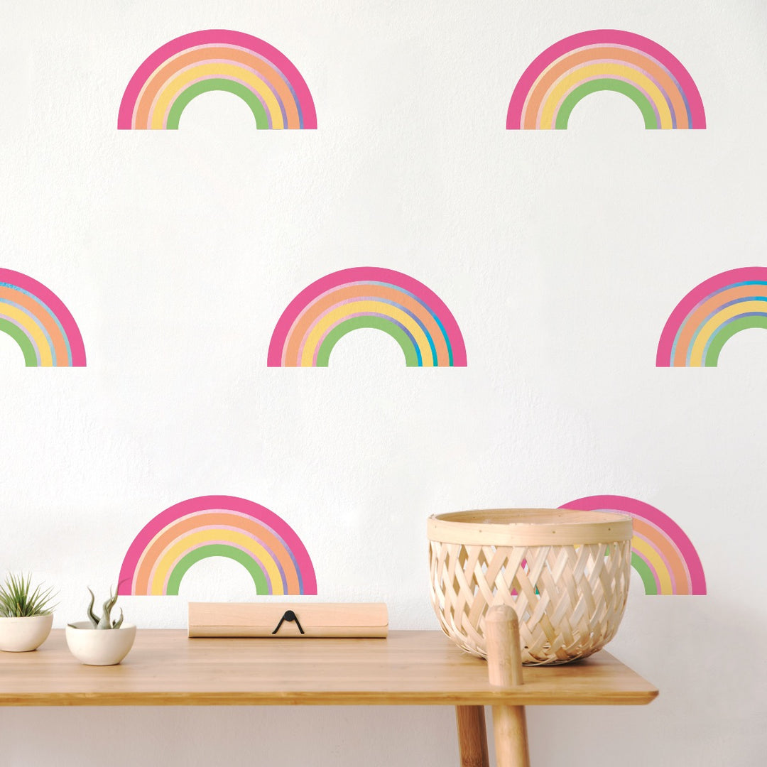 An up close look at Rainbow wall decals from Tempaper on the wall behind a side table.