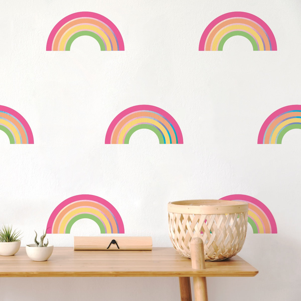 An up close look at Rainbow wall decals from Tempaper on the wall behind a side table.