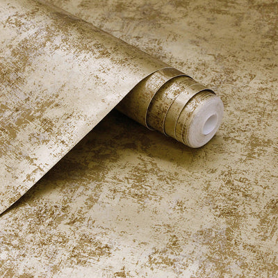 A slightly unraveled roll of Tempaper's Distressed Gold Leaf Peel And Stick Wallpaper in metallic gold shown#color_gold-leaf